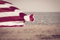 Bright striped beach umbrella as a summer background