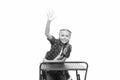 She is a bright student. Small girl student raising hand isolated on white. Little student reciting lesson in class Royalty Free Stock Photo