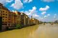 Florence Italy Houses along Arno River Under bright Blue Sky Royalty Free Stock Photo