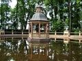 Bright summer landscape with pond and gazebo in chinese garden, Saint-Petersburg Royalty Free Stock Photo