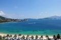 Bright summer sunny day. Vietnam. On the turquoise and aquamarine water of the bay, boats leave white foamy marks. Royalty Free Stock Photo