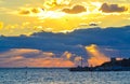 Bright sun above dark clouds over cross at pier Nessebar Old Town Bulgaria Royalty Free Stock Photo