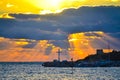 Bright sun above dark clouds over cross at pier Nessebar Old Town Bulgaria Royalty Free Stock Photo