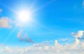 The bright sun, blue sky and clouds Royalty Free Stock Photo