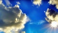 A bright sun in a blue sky among white clouds. The sun\'s rays in the blue sky. Generated by AI. International Sun Day. Royalty Free Stock Photo
