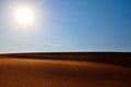 Bright sun, clear blue sky and rippled desert sand. Arabian Desert, Riyadh, Saudi Arabia