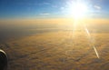 The bright sun illuminates the clouds, view from altitude