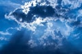 Sun Rays through Dark Blue Clouds Royalty Free Stock Photo