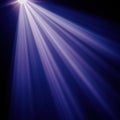 Bright Sun Rays Stretching Across a Deep Blue Sky Background Royalty Free Stock Photo