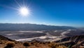 Bright sun setting over the Badwater Basin viewed from Dantes View in Death Valley, California, USA Royalty Free Stock Photo