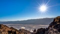 Bright sun setting over the Badwater Basin viewed from Dantes View in Death Valley, California, USA Royalty Free Stock Photo