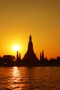 Bright Sun Shining over the Silhouette of Temple of Dawn or Wat Arun, Bangkok of Thailand