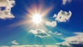 Bright sun in the sky among white fluffy clouds. The sun\'s rays in the blue sky. Generated by AI. International Sun Day. Royalty Free Stock Photo