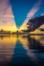 Bright sun at sunset or dawn over the water of the Pacific Royalty Free Stock Photo