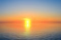 A bright sun before sunset reflected in the sea Royalty Free Stock Photo