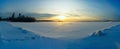 Bright sun sunset winter with road and footprints in the snow. Royalty Free Stock Photo