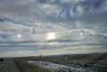 Bright sundogs are out with a cloud covered sky Royalty Free Stock Photo