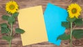 Bright sunflowers on an old wooden background, yellow and blue leaf Royalty Free Stock Photo