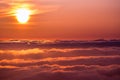 Bright sunlight reflected on a sea of clouds before sunset Royalty Free Stock Photo