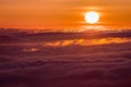 Bright sunlight reflected on a sea of clouds before sunset Royalty Free Stock Photo