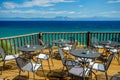 Bright Sunny Afternoon on the Wooden Terrace with View of the Turquoise Mediterranean Sea and Distant Mountains Royalty Free Stock Photo