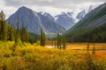 Bright sunny autumn landscape with sunlit gold valley and windin