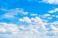 Bright sunny clouds on a blue sky. Heavenly background. Royalty Free Stock Photo