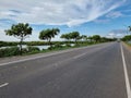 bright sunny day beautiful road highway symmetry pattern trees forest roadside plantations parallel paths greenery scenery