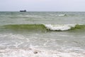 Bright sunny day stormy seascape with white sea foam