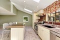 Bright sunny kitchen with vaulted ceiling and skylights.