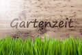 Bright Sunny Wooden Background, Gras, Gartenzeit Means Garden Time Royalty Free Stock Photo