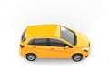 Bright sunny yellow modern compact car - front view - top down view Royalty Free Stock Photo