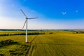 Bright sunrise in countryside, aerial landscape. Wind turbines in rural area. Alternative energy concept Royalty Free Stock Photo