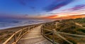 Bright sunset sky over sea and timber path Royalty Free Stock Photo