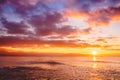 Bright sunset or sunrise in ocean. Landscape with warm sunset or sunrise colors Royalty Free Stock Photo