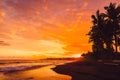 Bright sunset or sunrise with ocean waves and coconut palms in Bali, Keramas Royalty Free Stock Photo