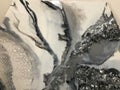 Bright surface abstract texture of canvas with stains of volumetric convex epoxy resin marble black and white creative multi-