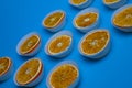 bright sweet tasty orange oranges in white muffin tins on a bright blue background Royalty Free Stock Photo