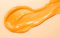 Tangerine Gel Texture Flowing on Soft Beige Background Surface Royalty Free Stock Photo