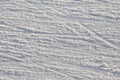 Bright traces of ice skating on an ice rink. background and texture Royalty Free Stock Photo