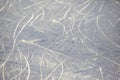 Bright traces of ice skating on an ice rink. background and texture Royalty Free Stock Photo