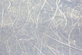 Bright traces of ice skating on an ice rink. background and texture Royalty Free Stock Photo