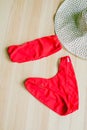 Bright trendy bikinis on a wooden background, as well as a straw hat with wide brims