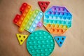 Bright trendy silicone push it pop it toy. Rainbow sensory fidget and wooden colorful toys. Antistress trendy toys for