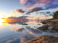 Bright tropial sunset reflected in ocean water