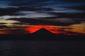 Bright tropical sunset and silhouettes of Agung volcano on the island of Bali in Indonesia. Royalty Free Stock Photo