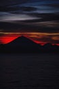 Bright tropical sunset and silhouettes of Agung volcano on the island of Bali in Indonesia. Royalty Free Stock Photo