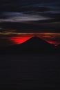 Bright tropical sunset and silhouettes of Agung volcano on the island of Bali in Indonesia. Royalty Free Stock Photo