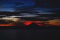 Bright tropical sunset and silhouettes of Agung volcano on the island of Bali in Indonesia. Royalty Free Stock Photo