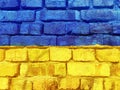 Bright Ukrainian flag painted on brick wall